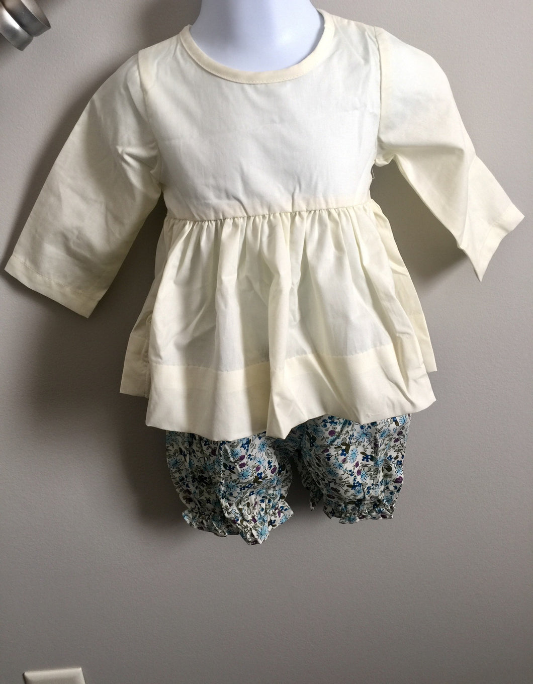 Cream top with floral bubble shorts